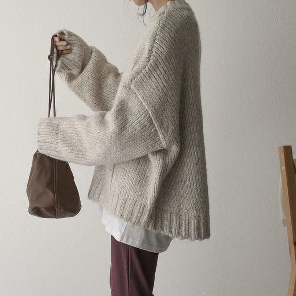 FallStil - Oversize Pullover mit elfenbeinfarbener Taschenfront